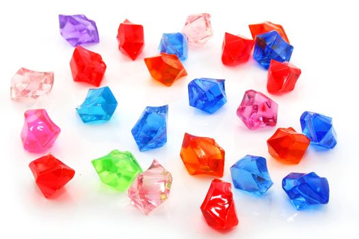 Colored assorted gemstones isolated on a white background