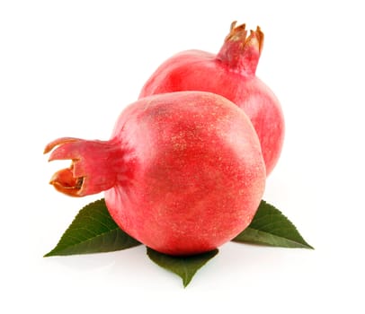 Ripe Red Pomegranates Fruits with Leaves Isolated on White Background