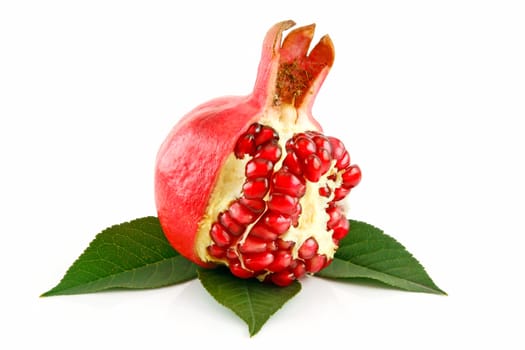 Ripe Sliced Pomegranate Fruit with Leaves Isolated on White Background
