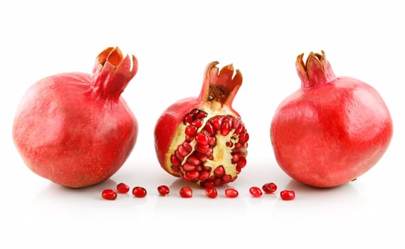 Ripe Sliced Pomegranate Fruit with Seeds Isolated on White Background