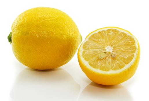 Fresh yellow lemon and slice isolated on a white background