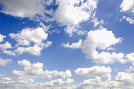 Background of sun illuminate white clouds in blue sky.