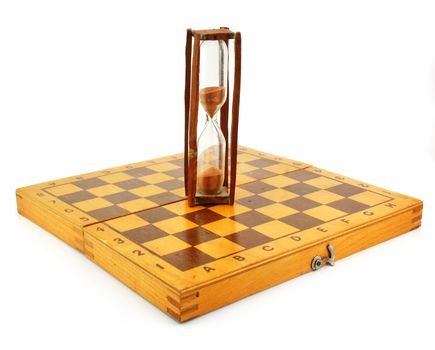 Chessboard and hourglass isolated on a white background