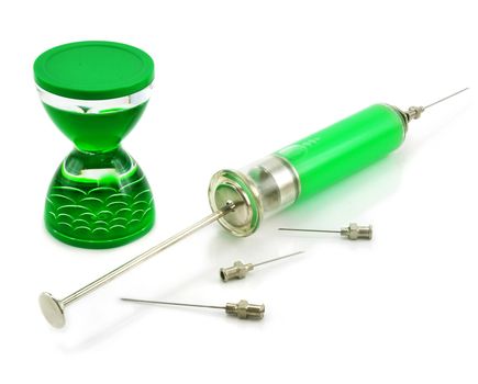 Liquid hourglass, syringe with toxic substance and needles isolated