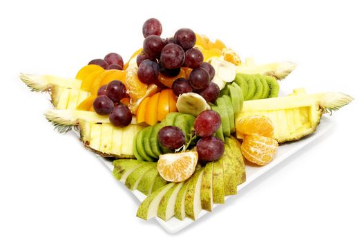 a plate of sliced fruit on white background