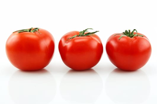 Three Ripe Tomatoes Isolated on White Background