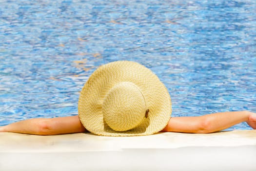 Woman in hat relaxing on holiday