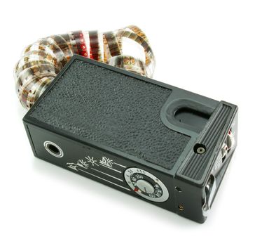 Small espionage photo camera and film isolated on a white background