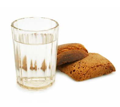 Crust of bread and glass of alcohol isolated on a white background 