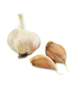 Garlic and two cloves isolated on a white background