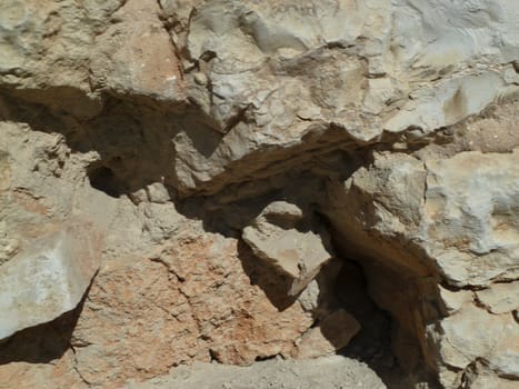 old stones in bright light and shadows