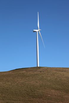 Wind turbine rotating through the air and generating power, WA., state.