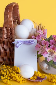 Happy Easter greeting card with eggs and spring flowers