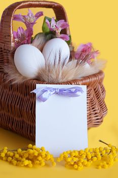 Happy Easter greeting card with eggs and spring flowers