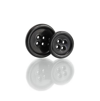 Two black buttons standing on white background. Isolated with clipping path