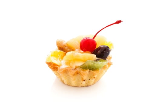 An image of a cake with cherry on top. On white background.