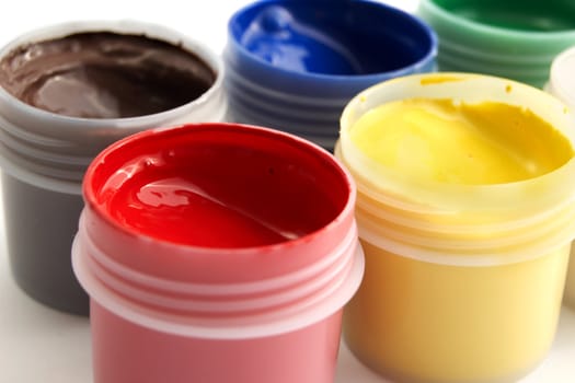 An image of many pots with paints