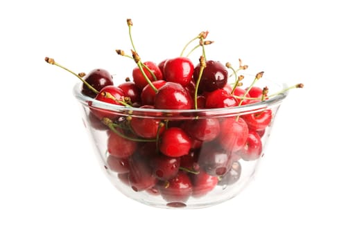 Red cherries in glass cup