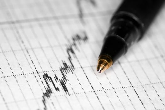 Stock photo: black pen on financial diagram