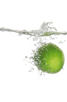 An image of green apple in water