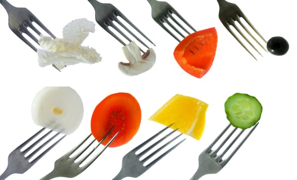 Stock photo: an image of eight forks with vegetables on them 