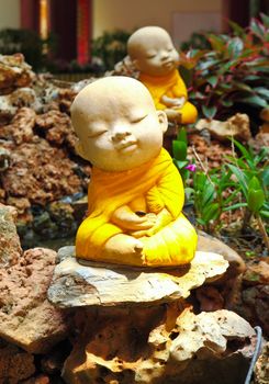 Doll clay monk used in ornamental garden in Thailand