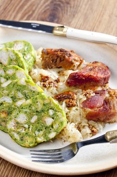 pork meat with herbal dumplings and cabbage