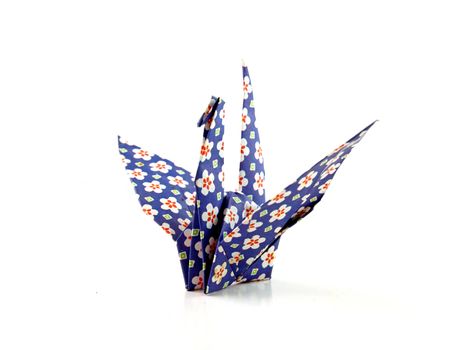 Crane origami bird folded with a floral pattern paper 