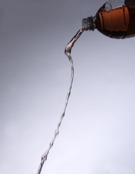 Pouring Red Lemonade from a bottle