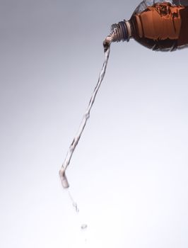 Pouring Red Lemonade from a bottle