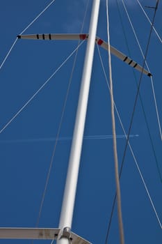 main mast of a racing ship with blue sky