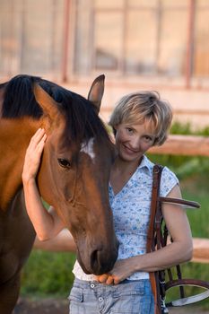 woman embrace brown horse