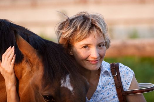 Woman looking to horse