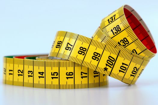 Yellow measuring tape with black numbers