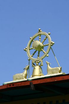 Wheel figure on a roof buddas monastery