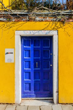 Door colorful houses of Burano, Venice, Italy