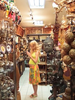 Thailand. Pregnant tourist from Europe in the gift shop