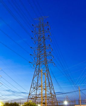 electric high voltage post in night sky