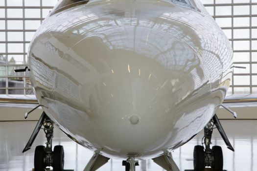 Close-up of the shiny nose of a commercial jet aircraft