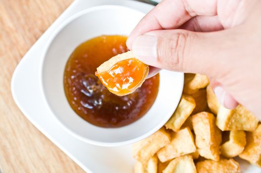 Fried Bean Curd with hand