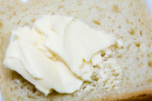 Stock photo: an image of yellow fresh butter on bread