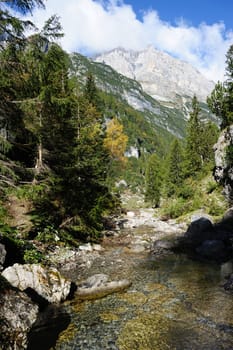 An image of great italian mountains and a stream