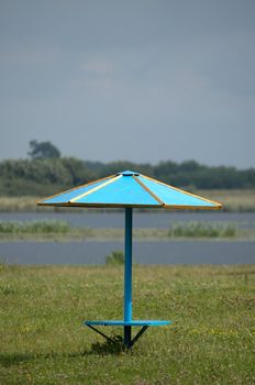 An image of umbrella on the beath