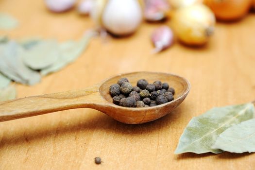 An image of spices on wooden table