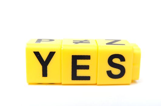 An image of yellow blocks with word ''yes'' on them