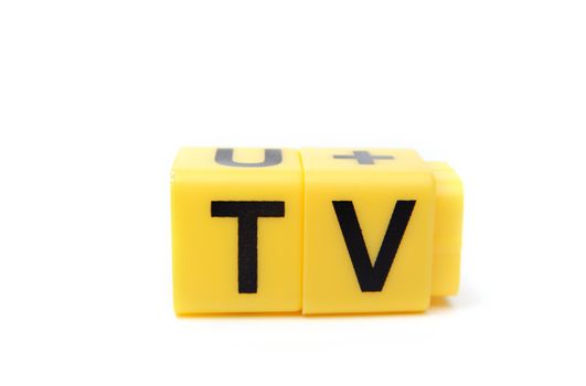 An image of yellow blocks with letters ''TV'' on them