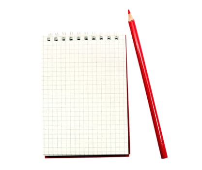 An image of notebook with red pencil on white background