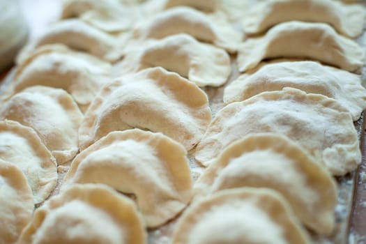 An image of raw dumplings on the board