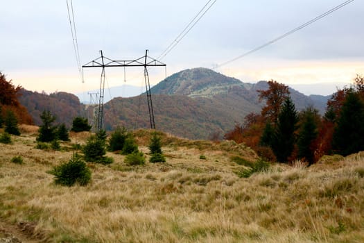 An image of power lines in the mountains