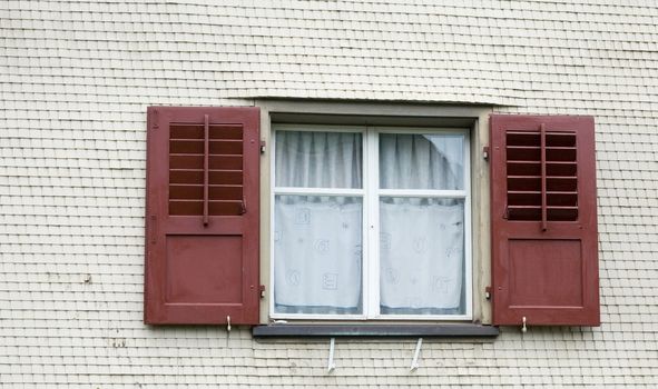 An image of a window with blinds